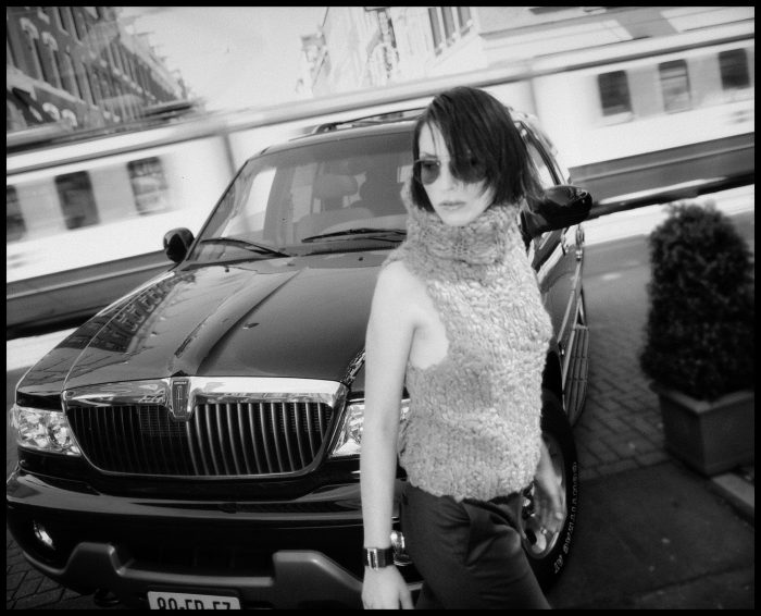 Beautiful woman in front of a car photoshoot by Michael Klinkhamer