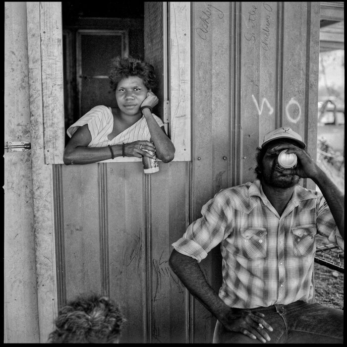 Australia_Outback drinking Aboriginal man and woman_klinkhamerphoto