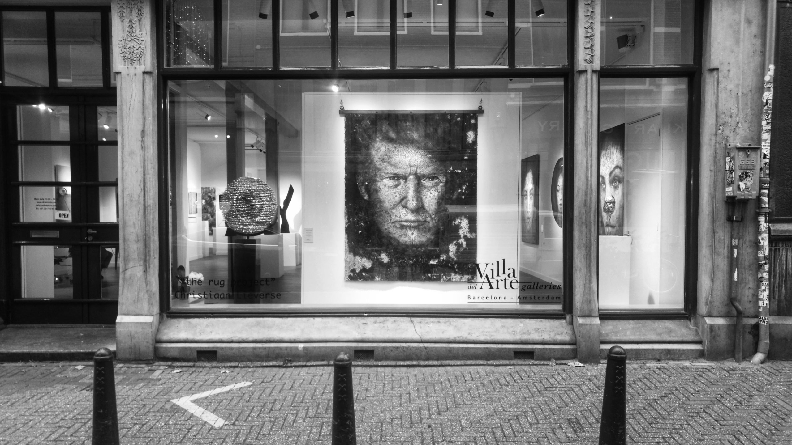 Donald Trump looking at you directly and intensely from behind an Amsterdam window