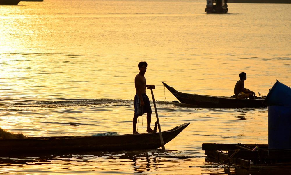 mekong river fisherman cambodia sunset